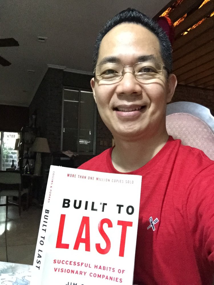 Manny Viloria holding Built To Last